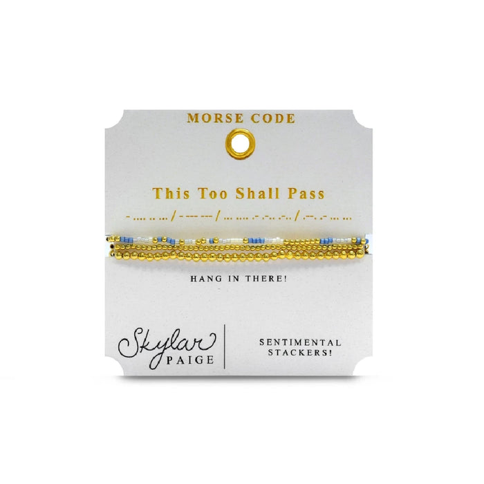 Elegant gold and blue bracelet inscribed with "the two shall pass," symbolizing resilience and hope.