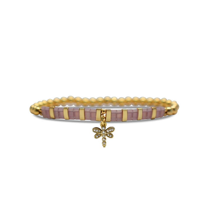A pink and gold bracelet featuring a delicate dragonfly charm, showcasing a blend of elegance and nature-inspired design.
