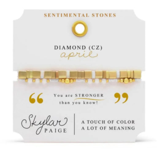 Stia Couture Sentimental Stones April birthstone bracelet with diamond CZ accents, gold-tone beaded stretch bracelet on gift card packaging.