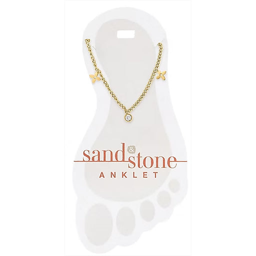 Gold anklet on a white display card with 'sand & stone' branding.