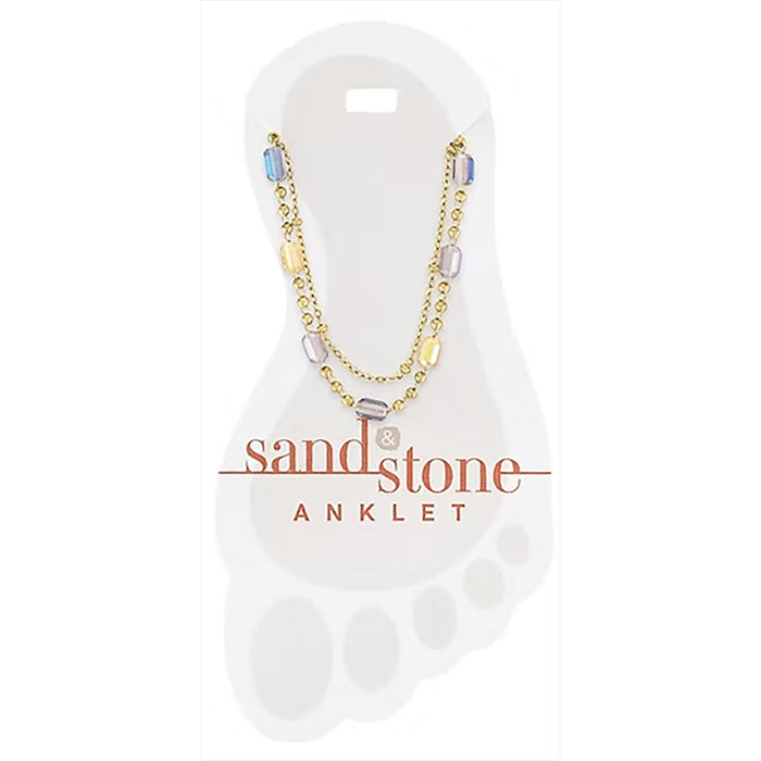 Gold anklet on a white card with 'sand & stone' branding
