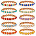 Assorted bracletes in gold on a white background 