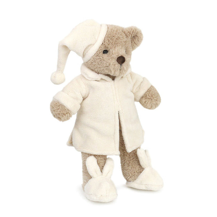 Plush teddy bear in a white coat and hat on a white background