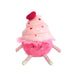 A pink cupcake stuffed animal featuring a heart on top, designed for cuddling and play.