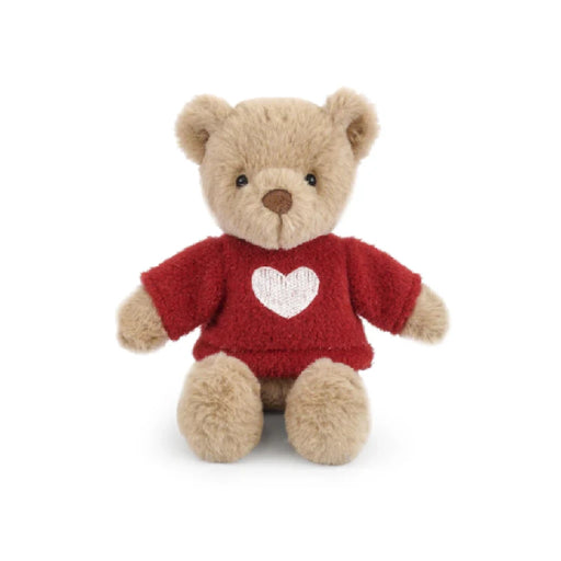 A teddy bear wearing a red sweater adorned with a heart symbol.