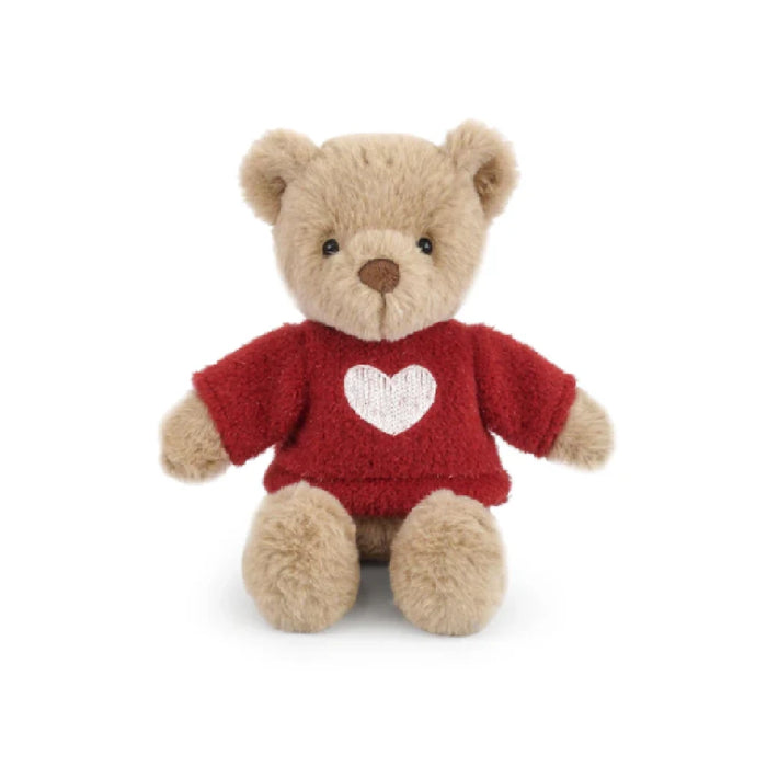 A teddy bear wearing a red sweater adorned with a heart symbol.