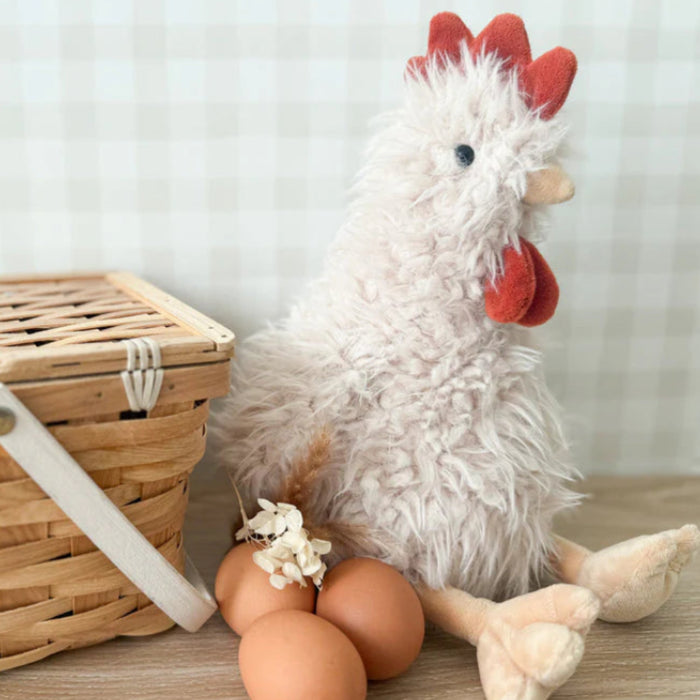 The fluffiest feathered friend on the farm! With it's tousled, cream-colored plumage that looks like it's been styled by the wind,
