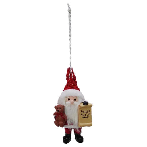 Decorative Christmas ornament of Santa Claus holding a teddy bear and a sign on a white background