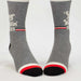 Gray socks with red and black accents on a white background