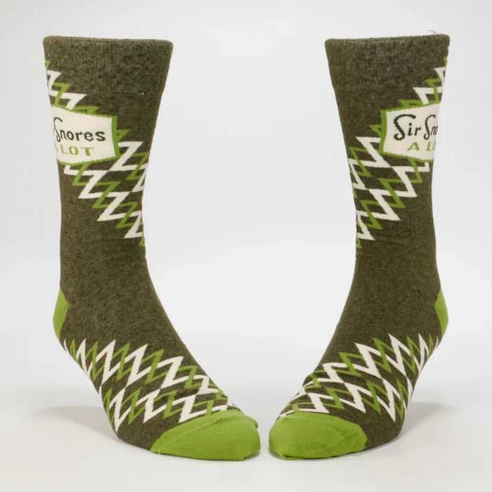 Pair of green socks with zigzag pattern on a white background