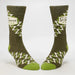 Pair of green socks with zigzag pattern on a white background