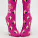 Pink socks with geometric patterns and text on a white background