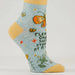 Sock with butterfly design and text on a light gray background