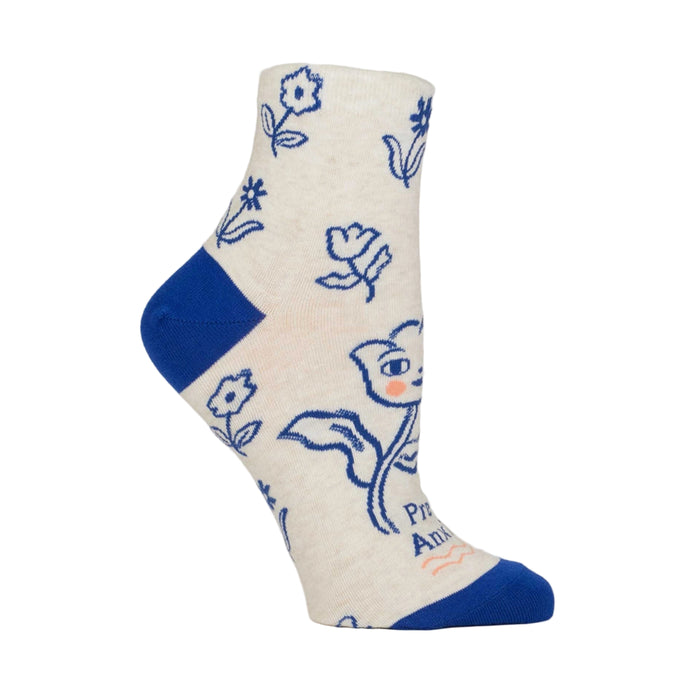 White sock with blue floral patterns and text on a light gray background
