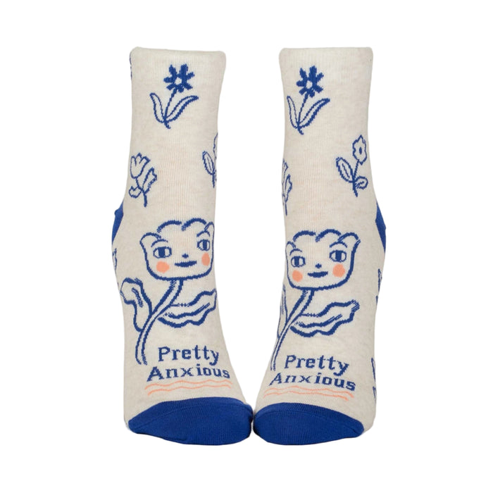 Pair of socks with floral design and 'Pretty Anxious' text on a white background