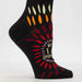 Black sock with colorful paw prints and text on a white background