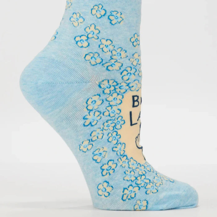 Light blue sock with floral pattern and text on a white background