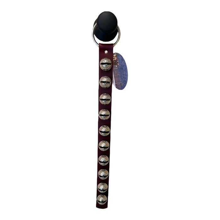 Dog collar with silver studs and a tag on a white background