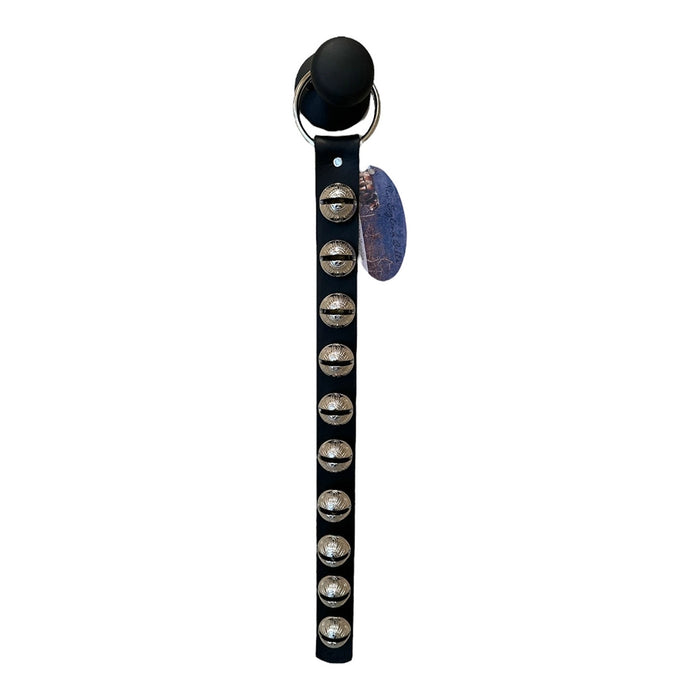Black strap with metallic studs and a round decorative piece on a white background