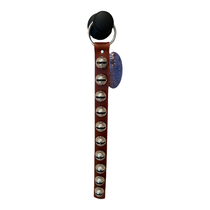 Leather strap with metal studs and a black clip on a white background