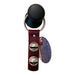 Black rubber ball with a leather strap featuring metal bells on a white background