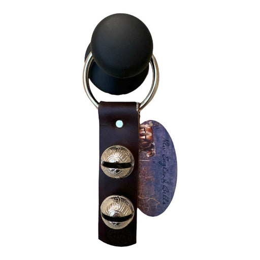 Black leather earring with gold accents and a brand tag on a white background