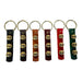 Set of six keychains with leather straps and gold accents on a white background
