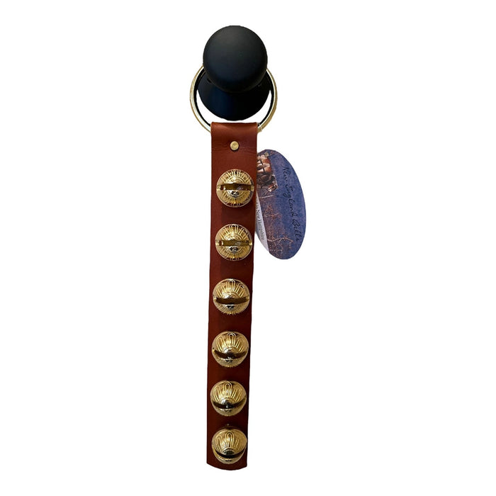 Brown leather strap with gold bell accents on a white background