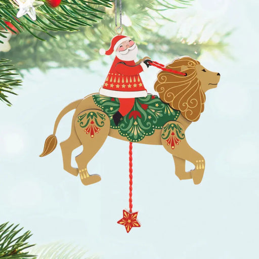 Christmas ornament with Santa riding a lion on a light blue background