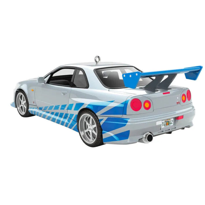 Model car with a blue and white design on a white background