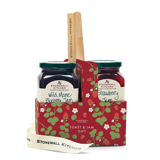 Stonewall Kitchen jam set with two jars and a wooden spreader in a decorative carrier on a white background.