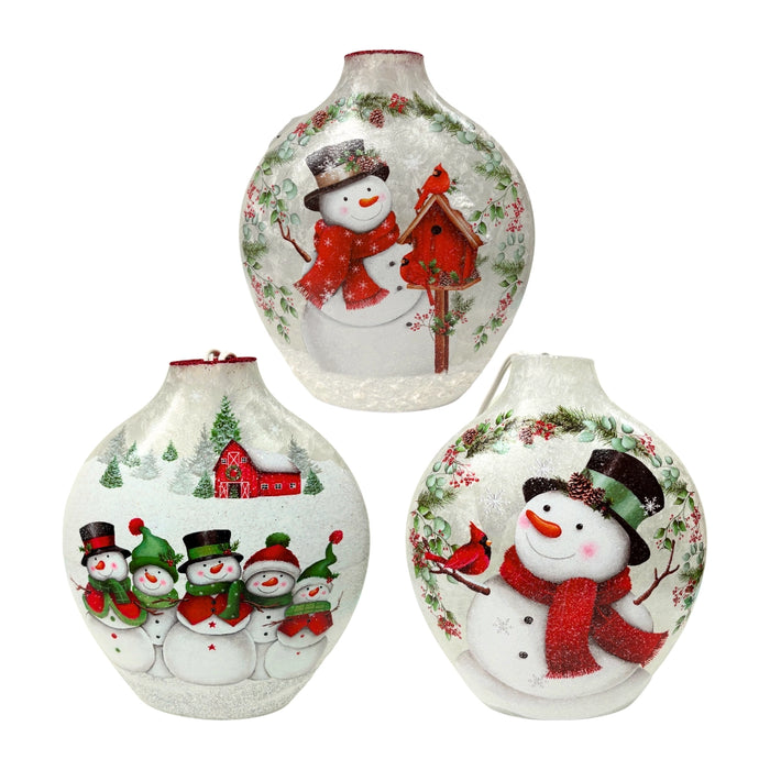 Three assorted Stony Creek circular pre-lit snowman vases showing different Christmas designs including birdhouses, cardinals, and winter barn scenes.