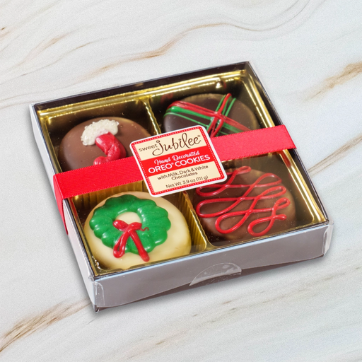 Sweet Jubilee Holiday Chocolate Covered Oreo Cookie Box with festive decorations and red ribbon.