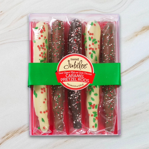 Sweet Jubilee Chocolate Covered Caramel Pretzel Rod Box with milk, dark, and white chocolate rods decorated with holiday sprinkles and green ribbon.