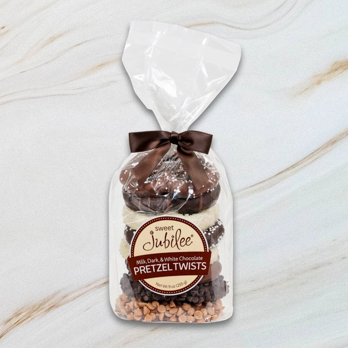 Sweet Jubilee Pretzel Stack Gift Bag with milk, dark, and white chocolate covered pretzel twists tied with brown satin ribbon.