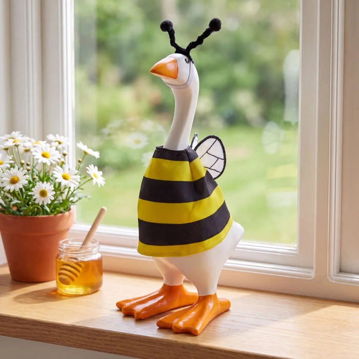 Gordy the Goose dressed in a bee-themed fabric costume for tabletop decoration