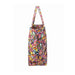 A stylish tote bag with a bright, colorful pattern, featuring an array of vivid colors and unique shapes.