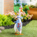A festive duck in a birthday hat, holding a colorful bag, symbolizing a joyful birthday party.