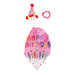 A duck with a party hat sits on the grass, bringing a whimsical element to a birthday celebration outdoors.