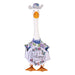 A duck in a shirt and hat stands amidst vibrant grass, creating a charming and amusing scene in nature.