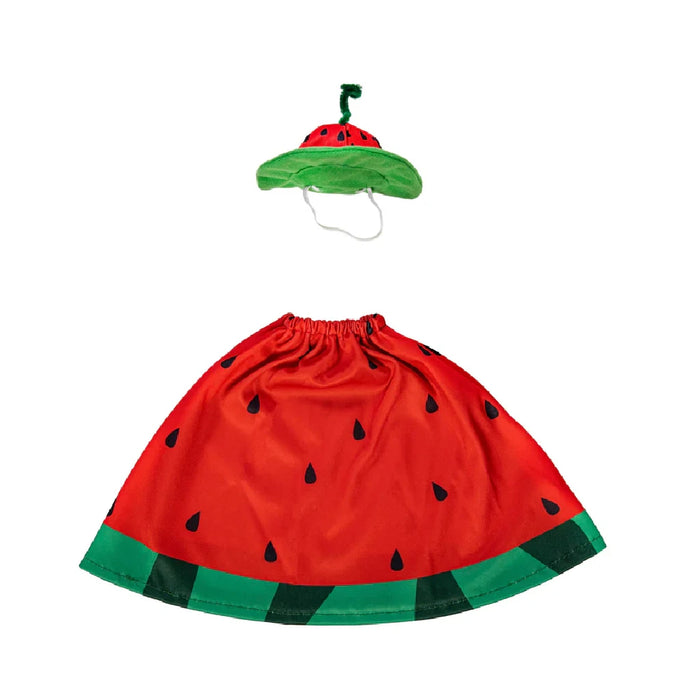 A duck adorned in a watermelon dress stands in a lush garden, showcasing a playful and vibrant atmosphere.