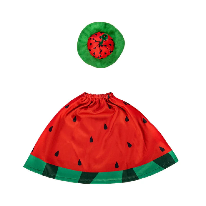 A cheerful duck in a watermelon dress stands in a garden, surrounded by colorful flowers and greenery.
