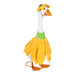 A duck sporting a cute dress, elegantly positioned among greenery.
