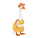 A duck in a fashionable dress and hat is situated in a garden, adding charm to the floral backdrop.