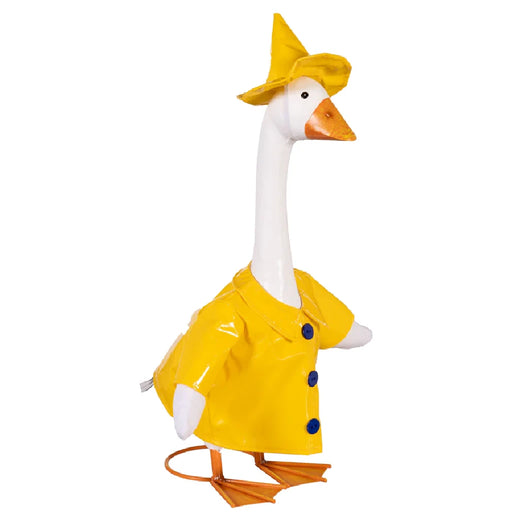 A duck dressed in a raincoat sits on a porch, showcasing its playful attire.