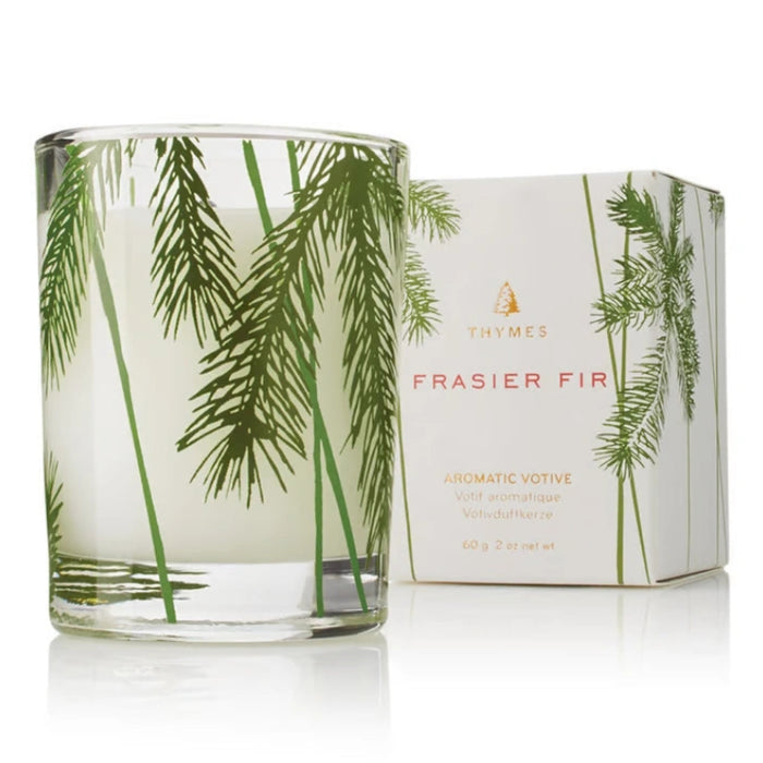 Frasier Fir votive candle with pine needle design for cozy seasonal home décor.