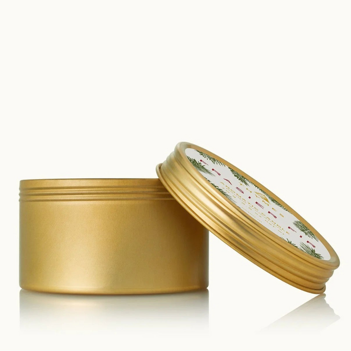 Frasier Fir® Travel Tin Candle with a fresh evergreen-inspired fragrance in a compact travel-size container.