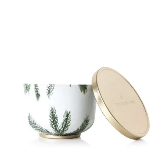 Tin Candle container with green leaf design and gold lid on a white background