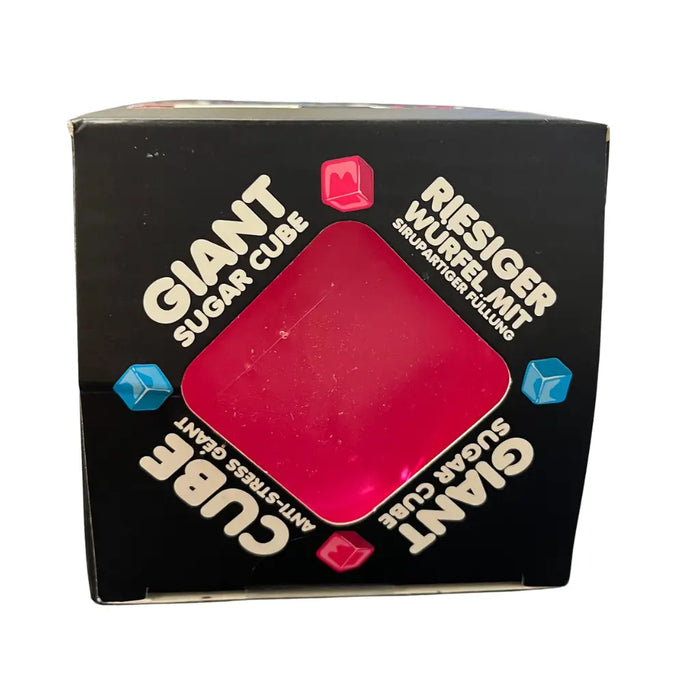 Box of a giant sugar cube with text on a white background
