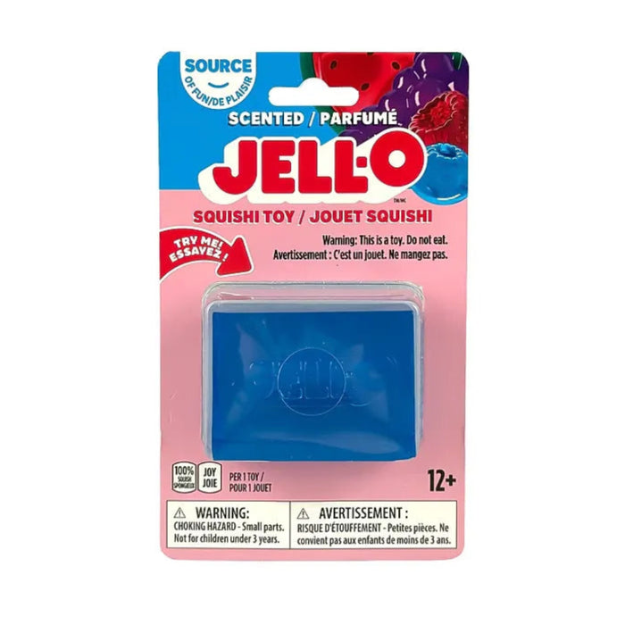 Hand squeezing a purple rectangular Jell-O Squishi toy, bending the soft sides around the embossed Jell-O logo.